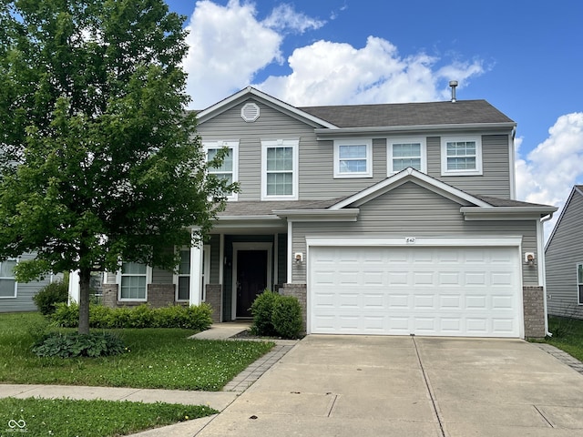 842 Westpointe Dr, Shelbyville, IN 46176 - traditional home with concrete driveway, brick siding, an attached garage, and a shingled roof