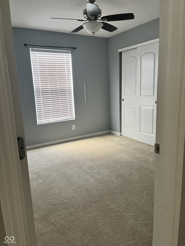 842 Westpointe Dr, Shelbyville, IN 46176 - unfurnished bedroom with carpet, a closet, ceiling fan, and baseboards