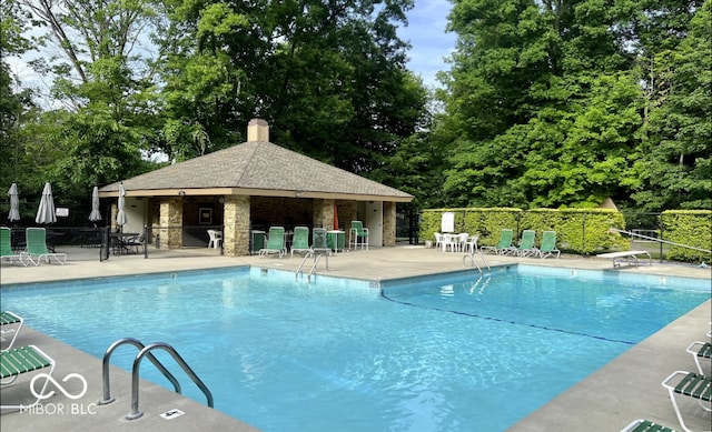 8331 Tequista Ct, Indianapolis, IN 46236 - community pool with a patio area, view of scattered trees, and a gazebo