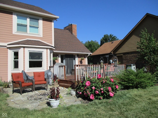 8331 Tequista Ct, Indianapolis, IN 46236 - back of house featuring a chimney, a deck, and roof with shingles