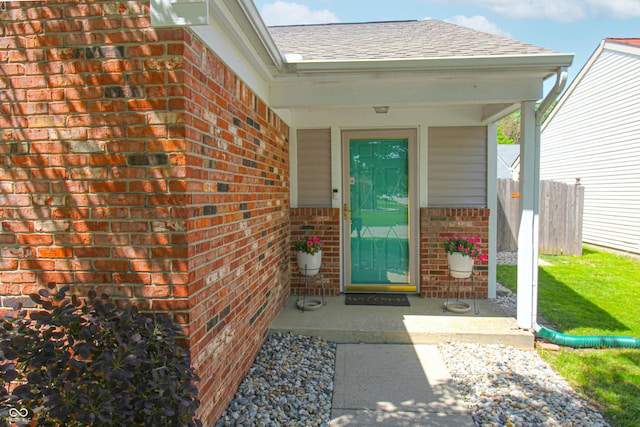 9774 Foxboro Ln, Fishers, IN 46038 - property entrance with brick siding and roof with shingles