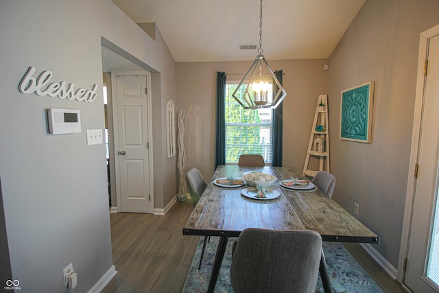9774 Foxboro Ln, Fishers, IN 46038 - dining area with dark wood-style floors, baseboards, a chandelier, and vaulted ceiling