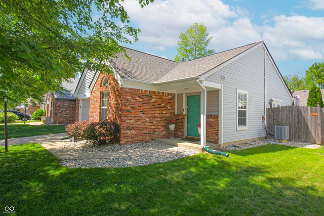 9774 Foxboro Ln, Fishers, IN 46038 - view of front of property featuring brick siding, roof with shingles, and central AC