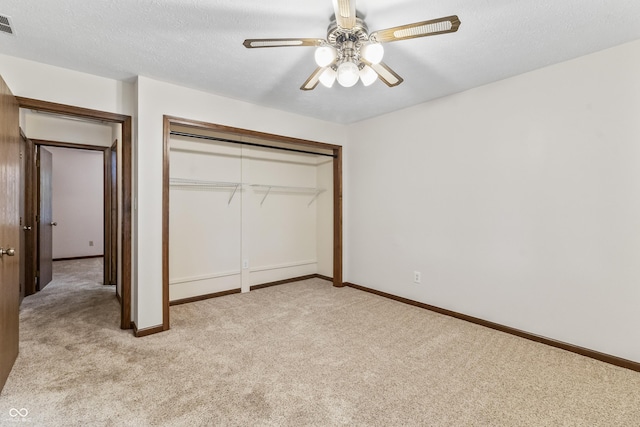 7426 N Carroll Rd, Indianapolis, IN 46236 - unfurnished bedroom with light colored carpet, a closet, a ceiling fan, and a textured ceiling