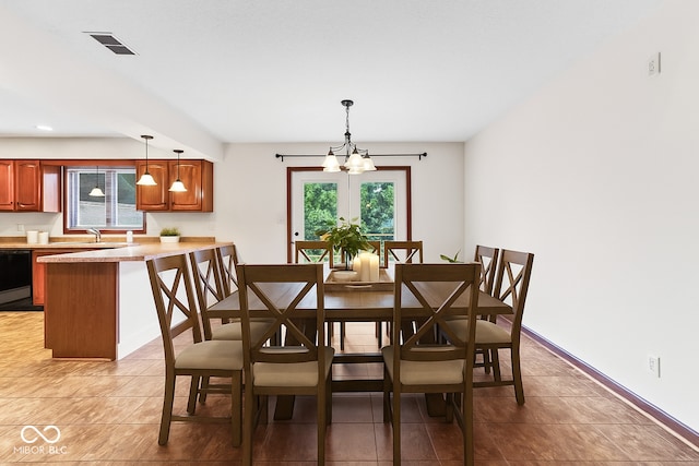 7426 N Carroll Rd, Indianapolis, IN 46236 - dining space featuring a chandelier, light tile patterned floors, and recessed lighting