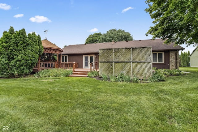 7426 N Carroll Rd, Indianapolis, IN 46236 - rear view of house featuring a gazebo, a deck, a lawn, and a shingled roof