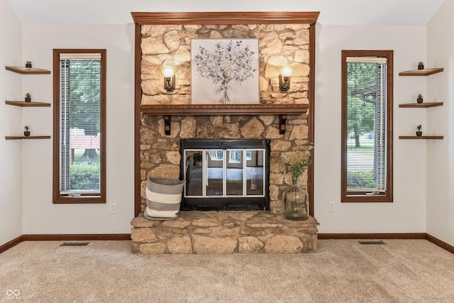 7426 N Carroll Rd, Indianapolis, IN 46236 - unfurnished living room featuring carpet flooring, a fireplace, and healthy amount of natural light
