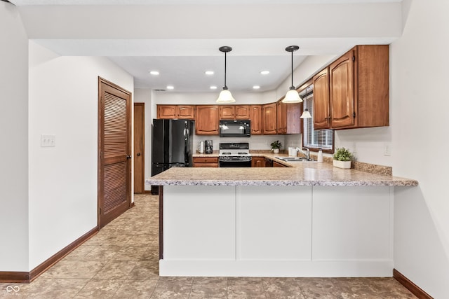 7426 N Carroll Rd, Indianapolis, IN 46236 - kitchen featuring black appliances, a peninsula, brown cabinetry, recessed lighting, and pendant lighting