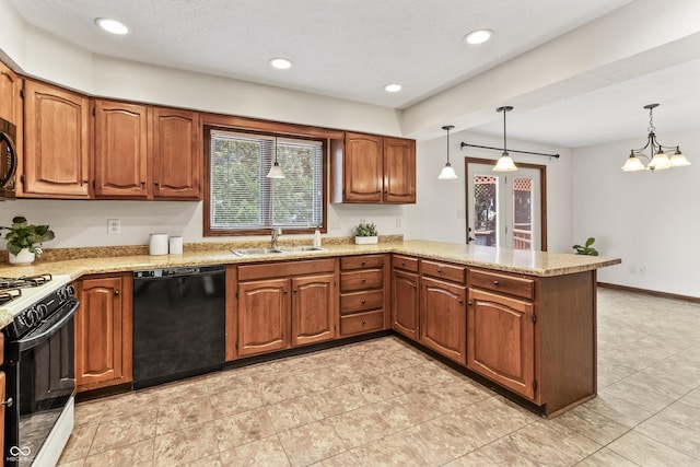 7426 N Carroll Rd, Indianapolis, IN 46236 - kitchen with black dishwasher, white gas range oven, a peninsula, brown cabinetry, and pendant lighting