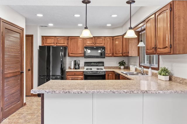 7426 N Carroll Rd, Indianapolis, IN 46236 - kitchen with black appliances, light countertops, a peninsula, recessed lighting, and hanging light fixtures