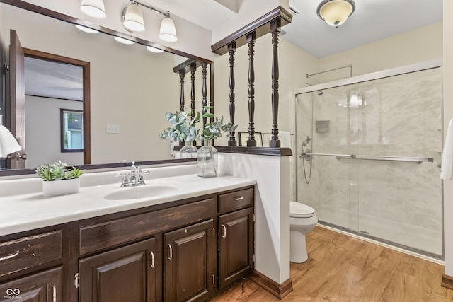 7426 N Carroll Rd, Indianapolis, IN 46236 - full bath featuring vanity, a stall shower, and wood finished floors