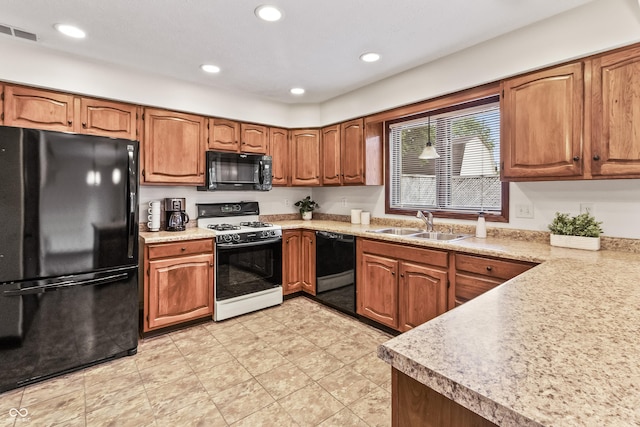 7426 N Carroll Rd, Indianapolis, IN 46236 - kitchen featuring black appliances, brown cabinets, recessed lighting, light countertops, and light tile patterned floors