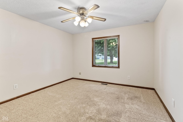 7426 N Carroll Rd, Indianapolis, IN 46236 - spare room with carpet, a ceiling fan, and a textured ceiling