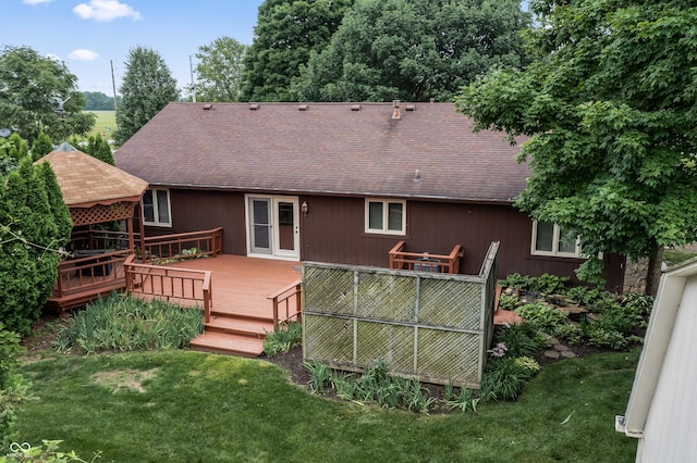 7426 N Carroll Rd, Indianapolis, IN 46236 - back of house with a shingled roof, a deck, and a yard