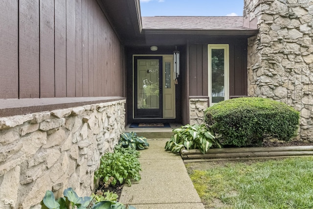 7426 N Carroll Rd, Indianapolis, IN 46236 - doorway to property with stone siding and a shingled roof
