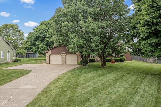 7426 N Carroll Rd, Indianapolis, IN 46236 - view of front of home featuring driveway, stone siding, and a garage