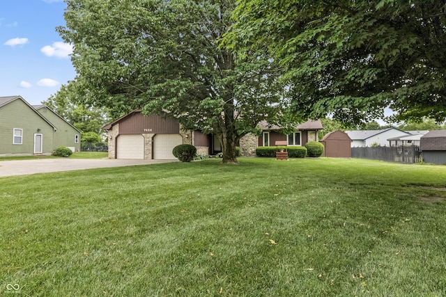 7426 N Carroll Rd, Indianapolis, IN 46236 - view of front of home with driveway, a garage, stone siding, and a front yard
