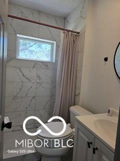 2421 N Arsenal Ave, Indianapolis, IN 46218 - full bath with toilet, vanity, and curtained shower