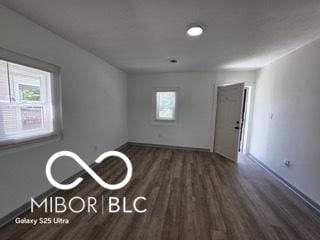 2421 N Arsenal Ave, Indianapolis, IN 46218 - unfurnished room with wood finished floors and baseboards