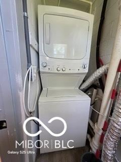 2421 N Arsenal Ave, Indianapolis, IN 46218 - laundry room with stacked washer and clothes dryer