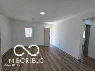 2421 N Arsenal Ave, Indianapolis, IN 46218 - unfurnished room with wood finished floors and baseboards