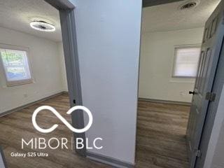 2421 N Arsenal Ave, Indianapolis, IN 46218 - hallway featuring wood finished floors and baseboards