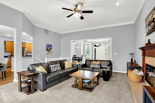 14492 Allison Dr, Carmel, IN 46033 - living room featuring a ceiling fan, ornamental molding, a chandelier, baseboards, and a tiled fireplace