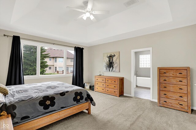 14492 Allison Dr, Carmel, IN 46033 - bedroom with carpet floors, a raised ceiling, ensuite bath, baseboards, and ceiling fan