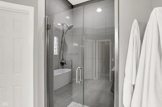 14492 Allison Dr, Carmel, IN 46033 - bathroom featuring a soaking tub and a shower stall