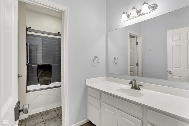 14492 Allison Dr, Carmel, IN 46033 - full bath with vanity, enclosed tub / shower combo, tile patterned flooring, and baseboards