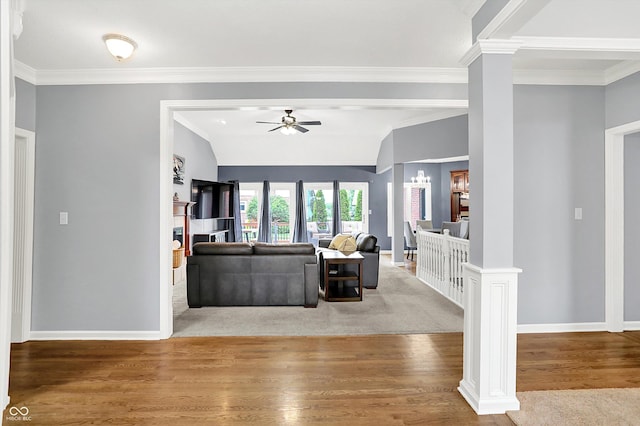 14492 Allison Dr, Carmel, IN 46033 - living area featuring crown molding, ornate columns, ceiling fan, wood finished floors, and baseboards