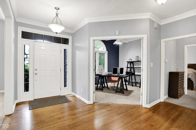 14492 Allison Dr, Carmel, IN 46033 - entrance foyer with wood finished floors, baseboards, and crown molding