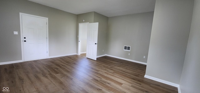 709 N Sterling Ave, Veedersburg, IN 47987 - spare room with dark wood-type flooring and baseboards
