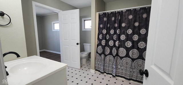 709 N Sterling Ave, Veedersburg, IN 47987 - bathroom with toilet, tile patterned floors, vanity, a shower with shower curtain, and baseboards