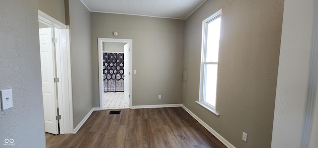 709 N Sterling Ave, Veedersburg, IN 47987 - empty room with crown molding, wood finished floors, and baseboards