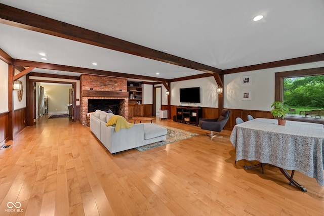 3503 S 9th St, Lafayette, IN 47909 - living area featuring a brick fireplace, wainscoting, beamed ceiling, light wood-style floors, and recessed lighting