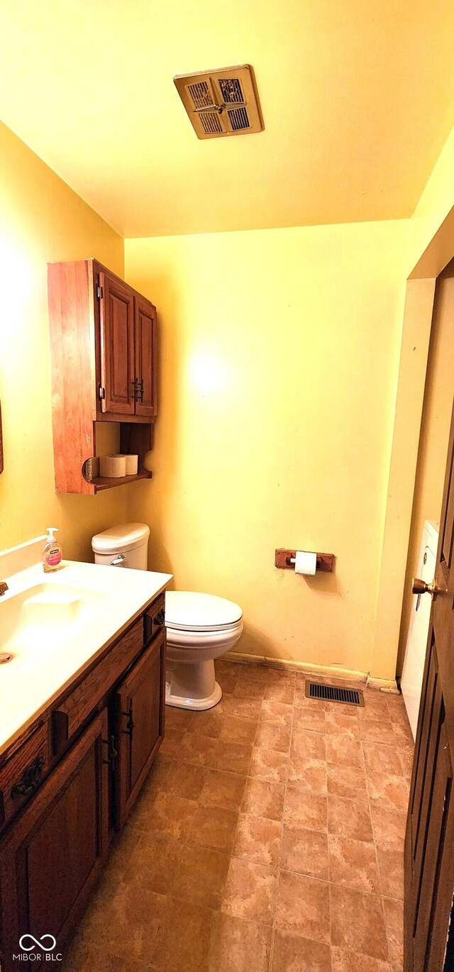 1619 Crest Ct, Indianapolis, IN 46214 - bathroom featuring toilet and vanity