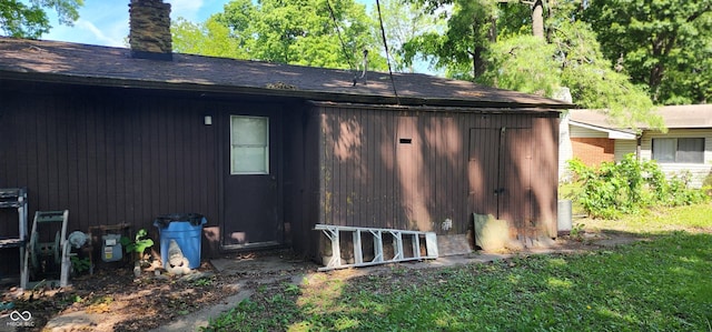 1619 Crest Ct, Indianapolis, IN 46214 - rear view of house with a chimney