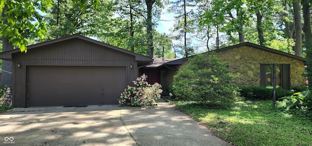 1619 Crest Ct, Indianapolis, IN 46214 - view of front of property featuring stone siding, driveway, and an attached garage