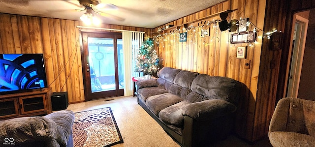 1619 Crest Ct, Indianapolis, IN 46214 - living room with wood walls, a ceiling fan, and light colored carpet