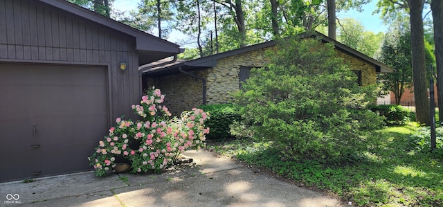 1619 Crest Ct, Indianapolis, IN 46214 - view of side of property with an attached garage and stone siding
