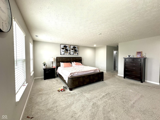 9133 Thames Dr, Avon, IN 46123 - bedroom featuring a textured ceiling, baseboards, and carpet floors