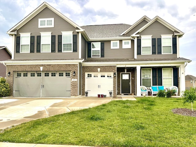 9133 Thames Dr, Avon, IN 46123 - view of front of house with an attached garage, a front yard, concrete driveway, and covered porch