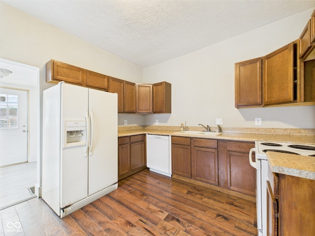 907 S A St, Elwood, IN 46036 - kitchen featuring white appliances, brown cabinets, and a textured ceiling