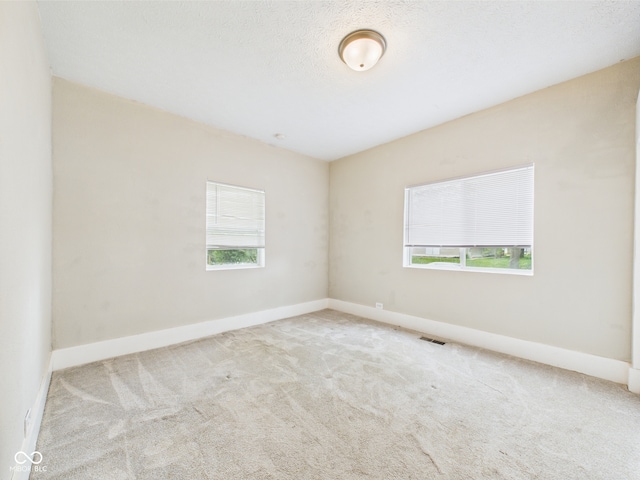 907 S A St, Elwood, IN 46036 - carpeted spare room featuring baseboards