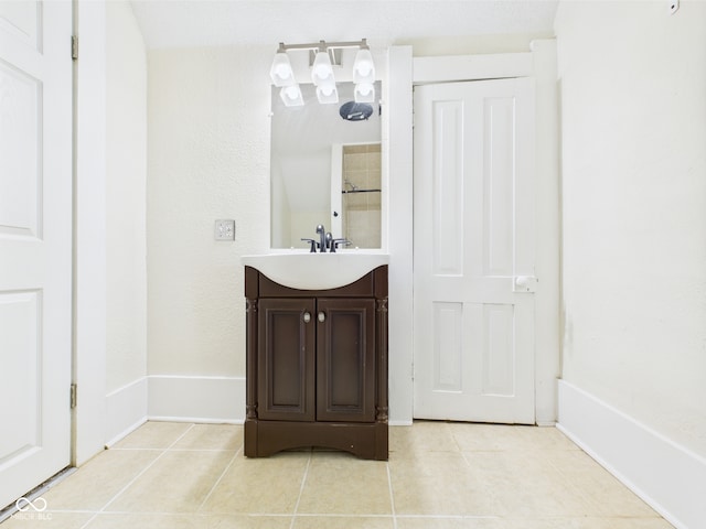 907 S A St, Elwood, IN 46036 - full bath with tile patterned floors, vanity, baseboards, and a shower