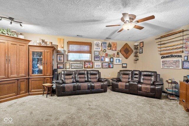 3480 W Broadus Dr, North Vernon, IN 47265 - carpeted living room featuring ceiling fan and a textured ceiling