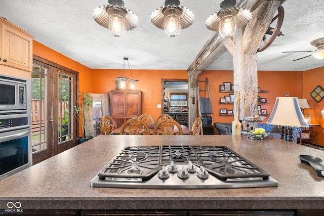 3480 W Broadus Dr, North Vernon, IN 47265 - kitchen featuring appliances with stainless steel finishes, a textured ceiling, light brown cabinets, ceiling fan, and french doors