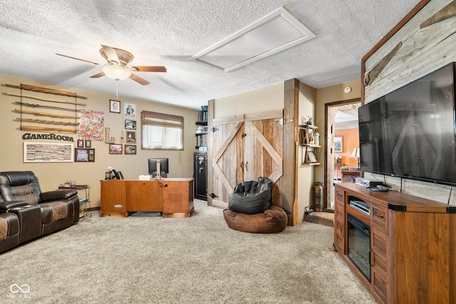 3480 W Broadus Dr, North Vernon, IN 47265 - living room featuring a ceiling fan, light colored carpet, attic access, a textured ceiling, and baseboards