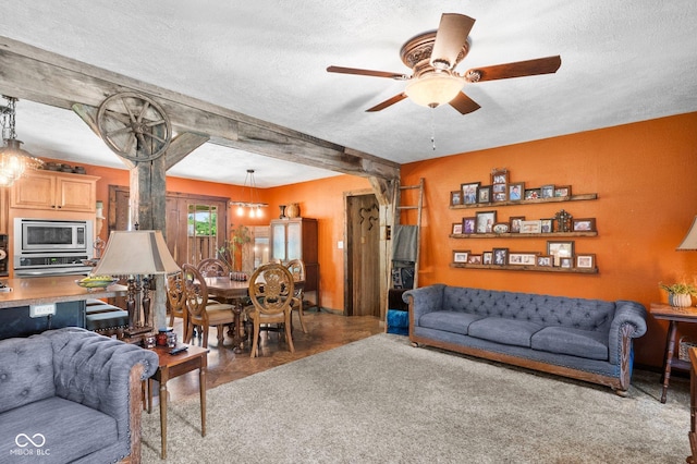 3480 W Broadus Dr, North Vernon, IN 47265 - living room with a textured ceiling, ceiling fan, and beamed ceiling